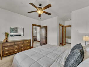 Bedroom with light carpet and ceiling fan