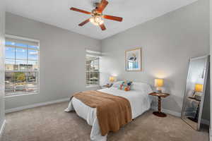 Bedroom with carpet and a ceiling fan