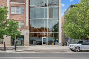 Doorway to property with brick siding