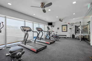 Workout area featuring ceiling fan and recessed lighting