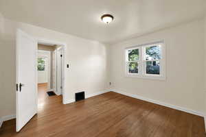 Bedroom featuring wood  floors