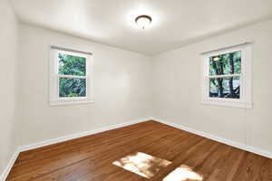 Bedroom featuring plenty of natural light and  hard wood floors