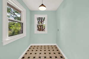 Kitchen nook featuring plenty of natural light and tile patterned floors