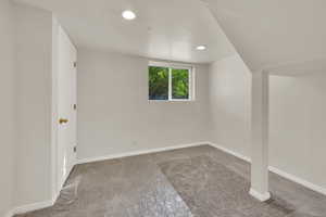 Basement bedroom with new light carpet