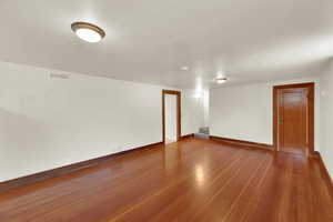 Nice sized family room featuring hardwood floors