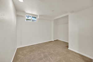 Bedroom featuring new light colored carpet and recessed lighting
