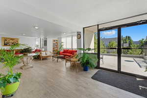 Lobby with a textured ceiling and floor to ceiling windows