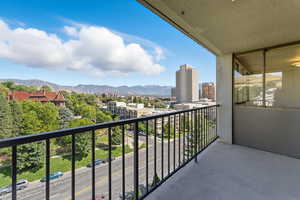 Balcony featuring a mountain and city view
