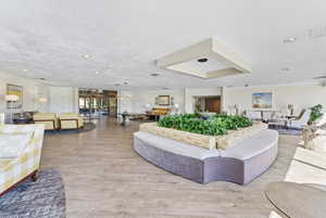Lobby featuring ornamental molding and recessed lighting
