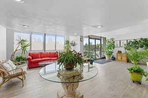 Building lobby with expansive windows and a textured ceiling
