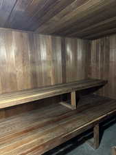 Relaxing separate his and hers sauna featuring wooden ceiling and seats in men's and women's restrooms