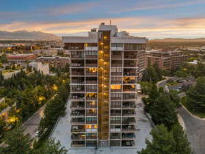 Property at dusk featuring a mountain view and a city view