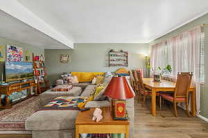 Living area with light wood-type flooring