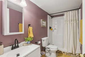 Bathroom with vanity and a shower stall