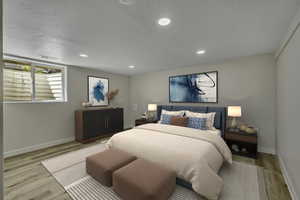 Bedroom featuring wood finished floors, recessed lighting, and a textured ceiling