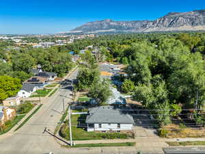 Aerial perspective of suburban area with a mountain backdrop