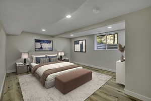 Bedroom with recessed lighting and light wood-style floors