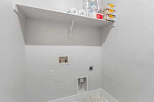 Laundry room featuring washer hookup and electric dryer hookup