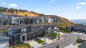 Aerial perspective of suburban area featuring a mountainous background