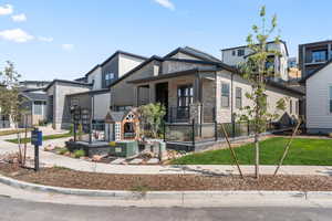 View of front facade featuring stone siding and covered porch