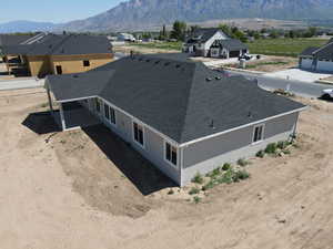 Aerial perspective of suburban area featuring a mountainous background