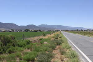 View of mountain backdrop featuring rural landscape