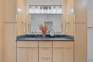 Bathroom featuring double vanity