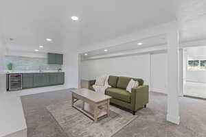 Living room with light colored carpet, wine cooler, wet bar, and recessed lighting