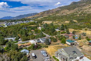 Aerial perspective of suburban area with a mountain backdrop