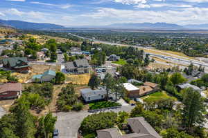Aerial view of residential area featuring a mountainous background