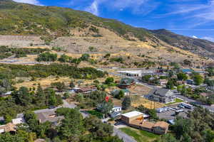 Aerial view of residential area featuring a mountainous background