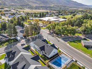 Aerial perspective of suburban area featuring a mountainous background