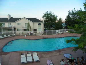Community pool featuring a patio area