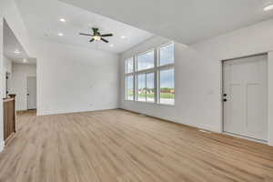 Unfurnished living room with recessed lighting, light wood-style flooring, and a ceiling fan