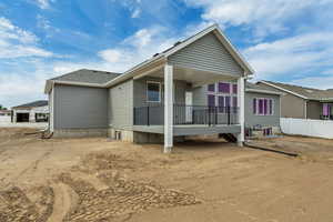 Rear view of house featuring a deck