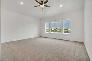 Spare room featuring light carpet, recessed lighting, and ceiling fan