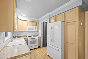 Kitchen on main level of home which also has room for a small dining table