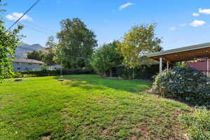 View of green lawn with a mountain view