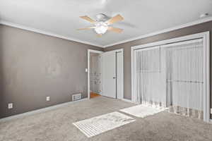 Bedroom on main level includes the ceiling fan and drapes and a double closet