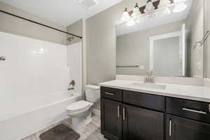 Full bath featuring shower / bathtub combination, vanity, and light wood-type flooring