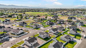 Aerial perspective of suburban area featuring a mountain backdrop