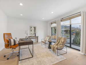 Office or living room with recessed lighting and light wood-style flooring