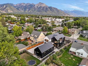 Aerial perspective of suburban area featuring a mountainous background