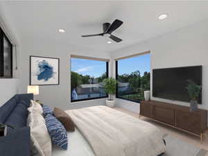 Bedroom with ceiling fan and recessed lighting