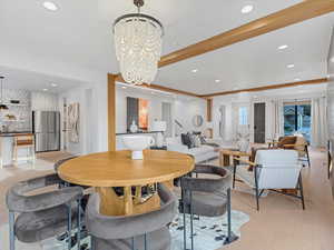Dining space featuring recessed lighting, light wood finished floors, and a chandelier