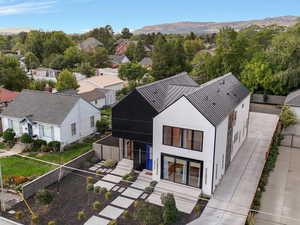 Aerial perspective of suburban area with a mountain backdrop