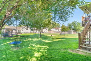 Fenced backyard with stairs