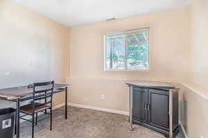Office area featuring carpet floors and baseboards