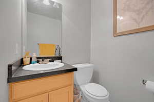 Bathroom featuring vanity and toilet