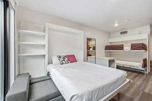 Bedroom featuring recessed lighting and wood finished floors
